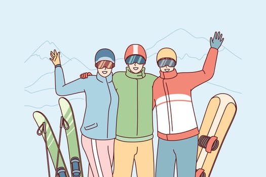 Company of friends at ski resort waving their hands posing on winter vacation. Three tourist people in ski goggles stand with snowy peaks after skiing or snowboarding. Flat vector illustration