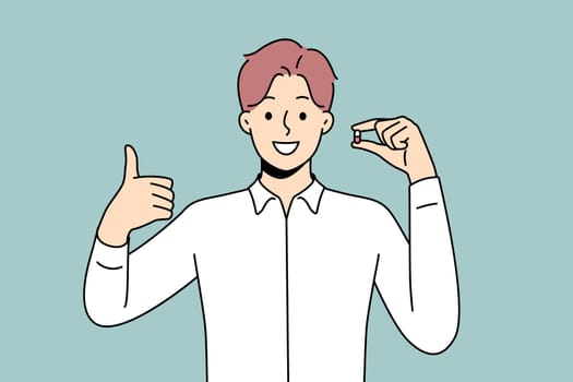 Smiling young man holding pill in hands showing thumb up. Happy male with tablet recommend treatment. Antidepressant or painkiller. Vector illustration.