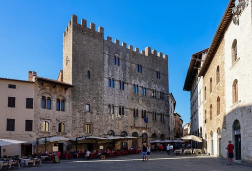 Massa Marittima, Italy - Sept 11, 2022: Garibaldi square and Palazzo del Podesta in Massa Marittima. Italy