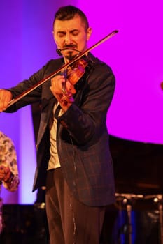 Cracow, Poland - July 4, 2022: Adam Baldych Quartet and Paolo Fresu live on stage of  Krakow Philharmonic at Summer Jazz Festival in Cracow, Poland