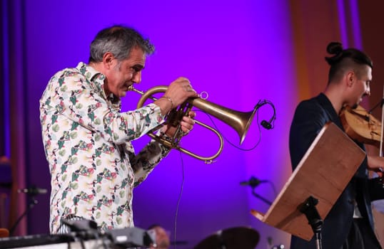Cracow, Poland - July 4, 2022: Adam Baldych Quartet and Paolo Fresu live on stage of  Krakow Philharmonic at Summer Jazz Festival in Cracow, Poland