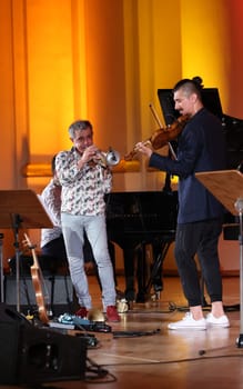 Cracow, Poland - July 4, 2022: Adam Baldych Quartet and Paolo Fresu live on stage of  Krakow Philharmonic at Summer Jazz Festival in Cracow, Poland