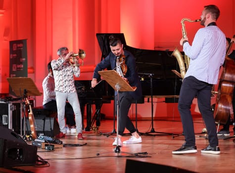 Cracow, Poland - July 4, 2022: Adam Baldych Quartet and Paolo Fresu live on stage of  Krakow Philharmonic at Summer Jazz Festival in Cracow, Poland