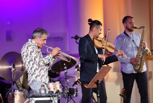 Cracow, Poland - July 4, 2022: Adam Baldych Quartet and Paolo Fresu live on stage of  Krakow Philharmonic at Summer Jazz Festival in Cracow, Poland