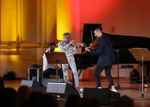 Cracow, Poland - July 4, 2022: Adam Baldych Quartet and Paolo Fresu live on stage of  Krakow Philharmonic at Summer Jazz Festival in Cracow, Poland