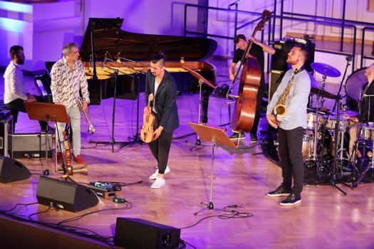 Cracow, Poland - July 4, 2022: Adam Baldych Quartet and Paolo Fresu live on stage of  Krakow Philharmonic at Summer Jazz Festival in Cracow, Poland