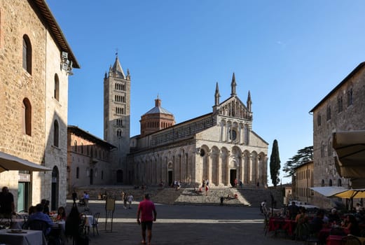 Massa Marittima, Italy - Sept 11, 2022:  the Cathedral of Saint Cerbonius with Bell tower at the Garibaldi square in Massa Marittima. Italy