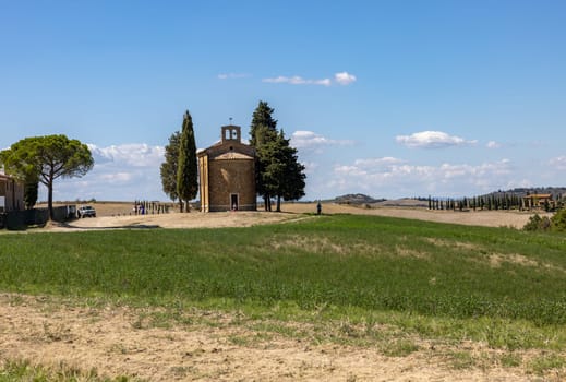Pienza, Italy - September 12, 2022: Capella Di Vitaleta in countryside between San Quirico and Pienza in Val d Orcia Tuscany. Italy