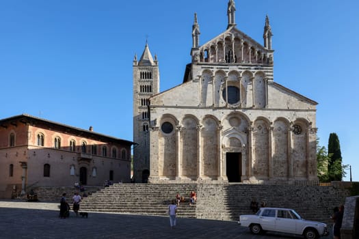 Massa Marittima, Italy - Sept 11, 2022: the Cathedral of Saint Cerbonius with Bell tower at the Garibaldi square in Massa Marittima. Italy