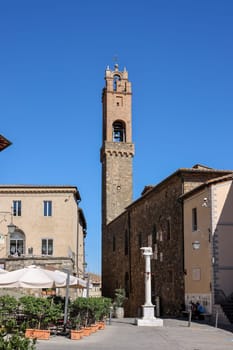 Montalcino, Italy - September 12, 2022: Piazza Garibaldi and Palazzo dei Priori in Hilltop town of Montalcino,Tuscany,Italy