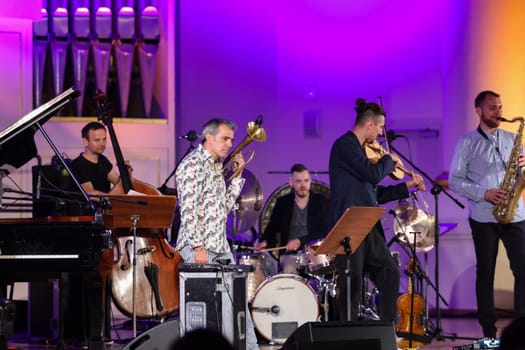 Cracow, Poland - July 4, 2022: Adam Baldych Quartet and Paolo Fresu live on stage of  Krakow Philharmonic at Summer Jazz Festival in Cracow, Poland
