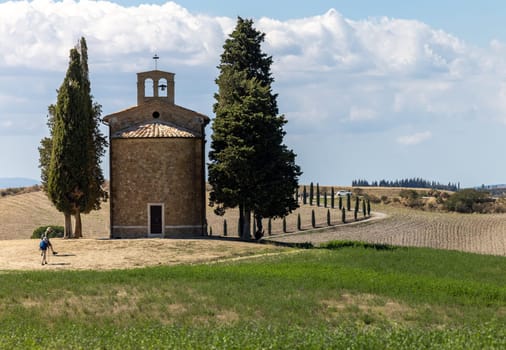 Pienza, Italy - September 12, 2022: Capella Di Vitaleta in countryside between San Quirico and Pienza in Val d Orcia Tuscany. Italy
