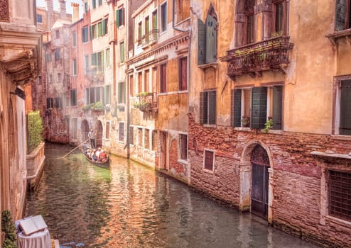 Gondoles Floating down the canals of Venice Italy.