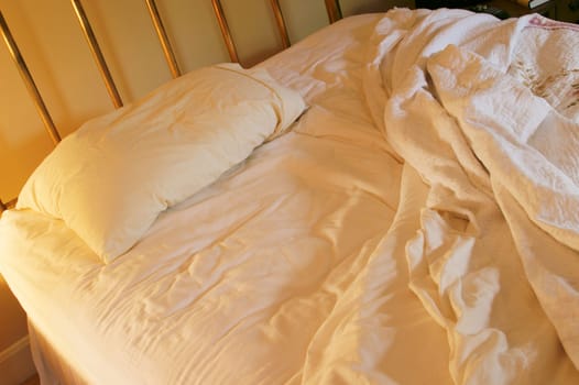Unmade bed, lonely.