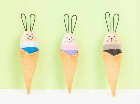 Cute easter bunny or rabbit in an ice cream cone, spring holiday, greeting card