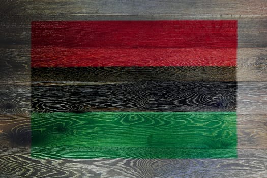 An African American flag on rustic old wood surface background