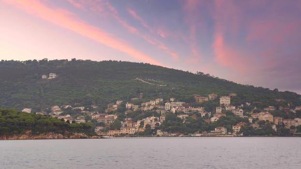 View of the mountains of Kinaliada island from Marmara Sea, with traditional summer houses and boats, Istanbul, Turkey