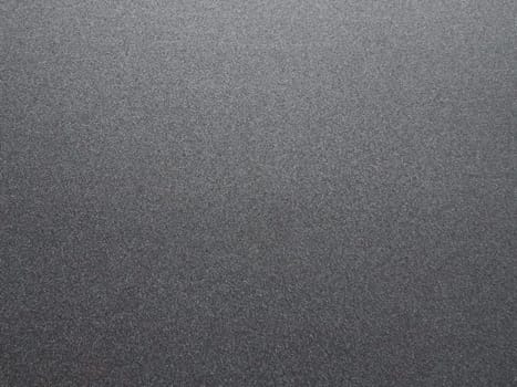 Black glitter texture christmas background. Bent shiny velvet paper.