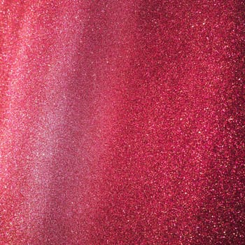 Bokeh light of pink glitters. Magenta glitter texture background. Sparkling glitter wrapping paper with sequins and sparkles. Festive purple bokeh and glitter. Diagonal stripes and waves.