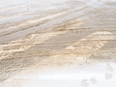 Snow, ice, slush and winter mud at a pedestrian crossing. The air temperature is about 0. Difficult driving conditions. Braking distance of the car. Traffic Laws. Infrastructure and road services.