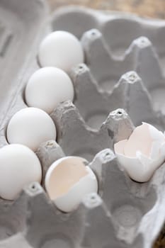 Carton of White Chicken Eggs and Egg Shells.
