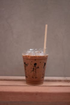 Iced mocha on wooden table, stock photo