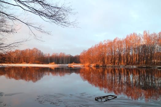winter landscape by the river quiet, golden hour