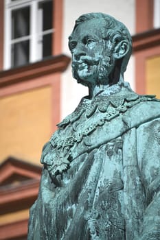 The monument to King Maximilian II of Bavaria stands in front of the Old Palace in Bayreuth on the courtyard. The statue of the Maximiliansdenkmal was cast in 1860 and stands on a granite base.