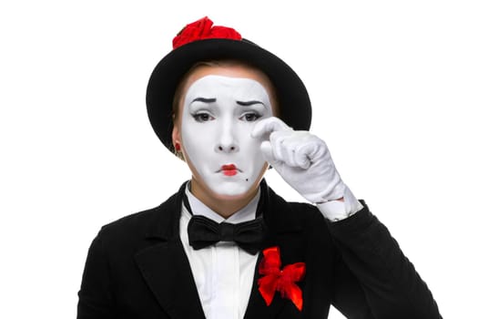 Portrait of the sad and crying woman as mime isolated on white background. Concept of sadness