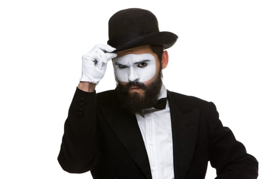 Portrait of the suspicious mime isolated on white background. Concept of suspicion and hostility
