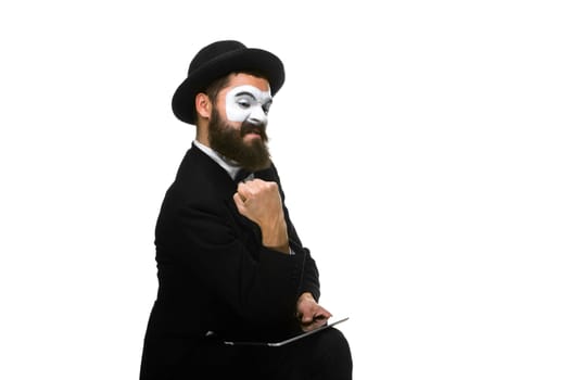 Mime sa businessman has stress because of computer problem. Isolated on white.