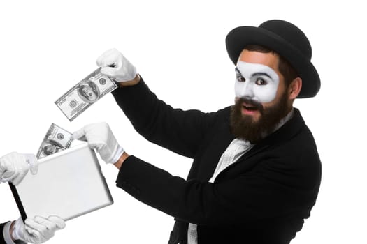 businessman's hand in the form of mime extract money from tablet PC, isolated on white
