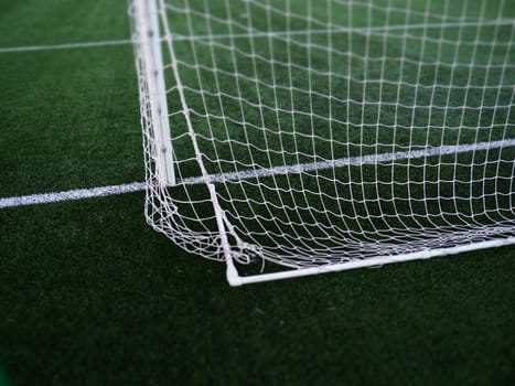 Soccer Goal Net with Grass Background. Football field markings and stripes.