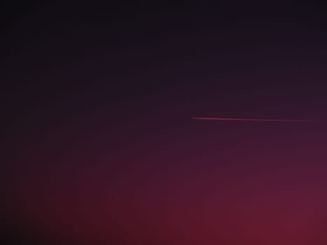 the plane and the trail in the crimson-burgundy sky. Abstract background on space or aero theme.