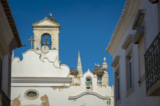 Faro, Portugal, September 2022: Detail view on the architecture of Arco da Vila in Faro, Portugal. Neoclassical arch which is the entrance to the old town.