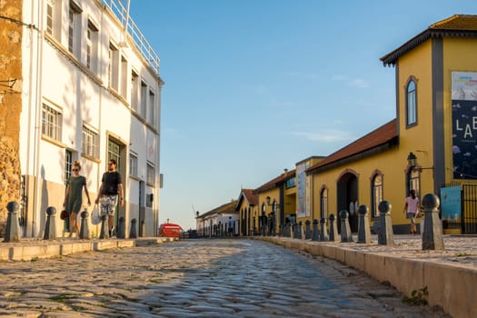 Faro, Portugal, September 2022: Low angle view on a cobblestoned street in the old town of Faro.