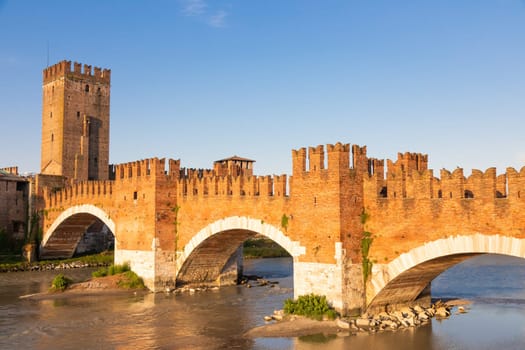 Verona, Italy. Castelvecchio bridge on Adige river. Old castle sightseeing at sunrise