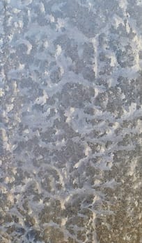 blue ice frozen water natural background. process of Deposition on glass. Winter pattern. Texture winter background. Patterned texture from frozen water on the glass. desublimation. natural design