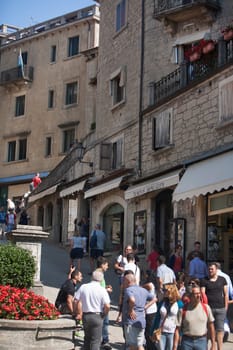 Tourists gather at the water fountain of San Marino. San Marino is the 5th smallest country in the world.