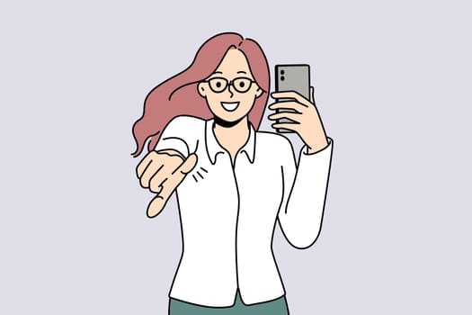 Smiling young woman hold cellphone point at screen. Happy girl with smartphone in hands show with finger at camera make choice. Vector illustration.