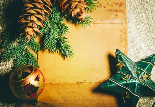 Christmas holiday paper background with fir tree and christmas decoration top view design. Xmas frame for new year wish list letter to santa. Merry Christmas empty card.