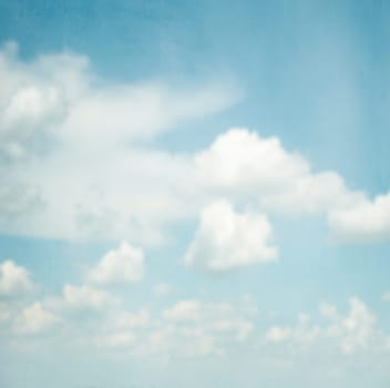 Blue sky and clouds on art canvas textured background. Aerial nature landscape creative design.