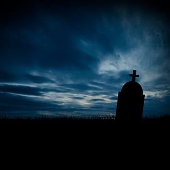 Halloween scary tombstone with orange burning sky. Horror graveyard silhouette at night. October 31 halloween party poster design background.