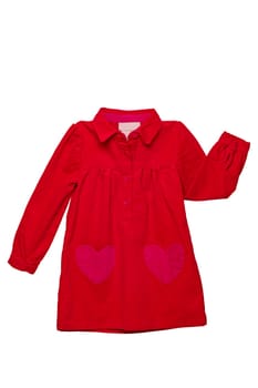 Summer dress isolated. A beautiful red girl's dress with attached heart shaped pockets and long sleeves isolated on white. Clipping path. Kids spring and autumn fashion.