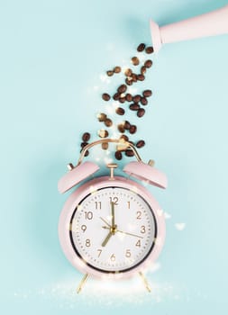 Wake up in the morning, time for breakfast, coffee break, alarm clock with roasted beans and hearts pouring from a watering can