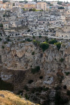 Panoramic view of Sassi di Matera a historic district in the city of Matera, well-known for their ancient cave dwellings from the Belvedere di Murgia Timone,  Basilicata, Italy