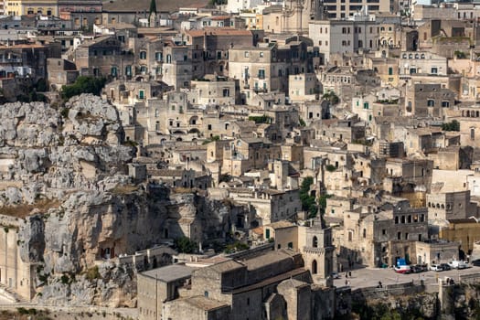 Matera, Italy - September 19, 2019: Panoramic view of Sassi di Matera a historic district in the city of Matera, well-known for their ancient cave dwellings from the Belvedere di Murgia Timone,  Basilicata, Italy