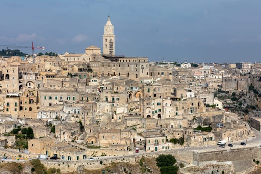 Matera, Italy - September 19, 2019: Panoramic view of Sassi di Matera a historic district in the city of Matera, well-known for their ancient cave dwellings from the Belvedere di Murgia Timone,  Basilicata, Italy