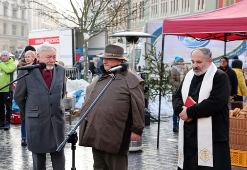 Krakow, Poland - Dec 18, 2022: Christmas Eve for poor and homeless on the Main Square in Cracow. The group Kosciuszko prepares the greatest eve in the open air in Krakow