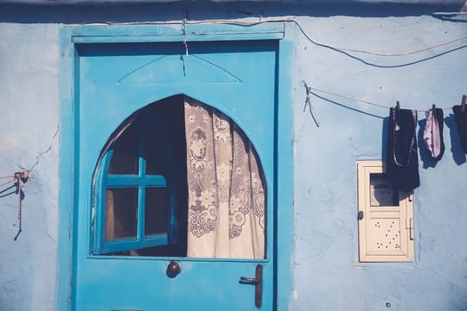 Procida island with colorful houses in small town street